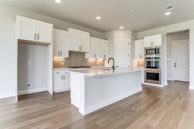 washroom featuring cabinets and sink