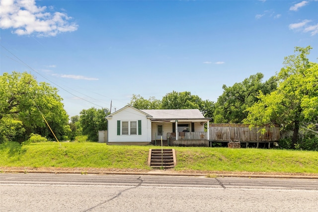 ranch-style house with a front lawn