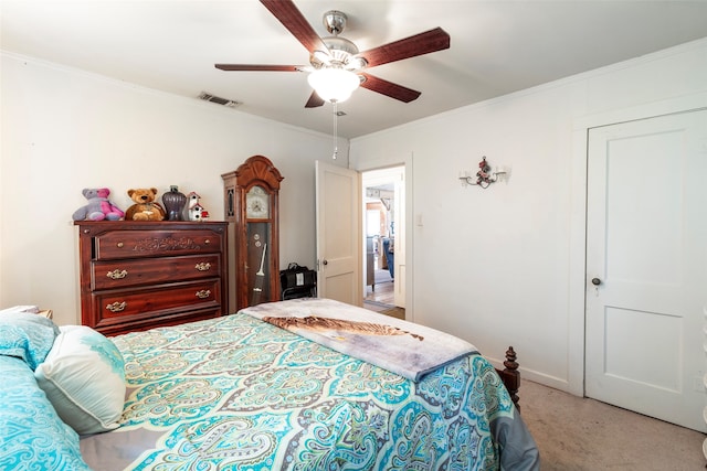 carpeted bedroom with crown molding and ceiling fan