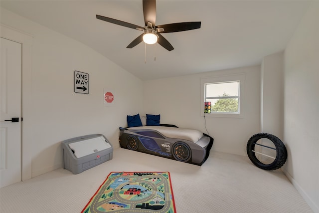 bedroom featuring lofted ceiling, ceiling fan, and carpet floors