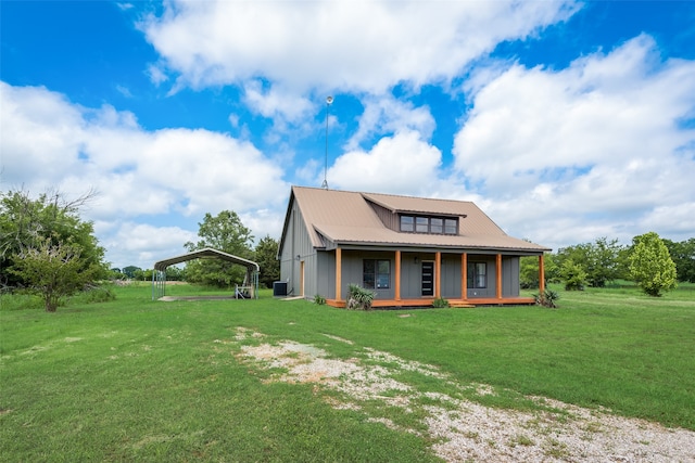 farmhouse featuring a front yard, covered porch, and central air condition unit