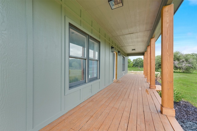 wooden deck with a yard