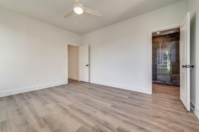 spare room featuring ceiling fan and light wood-type flooring