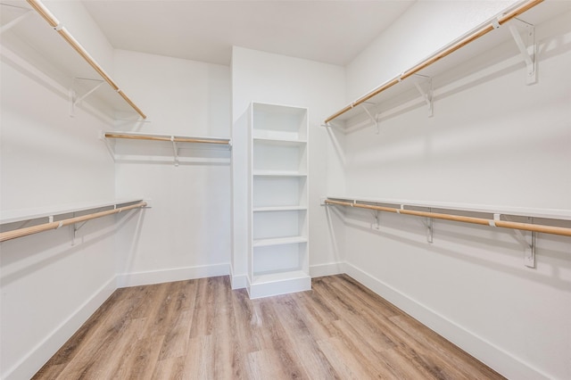 spacious closet featuring hardwood / wood-style floors