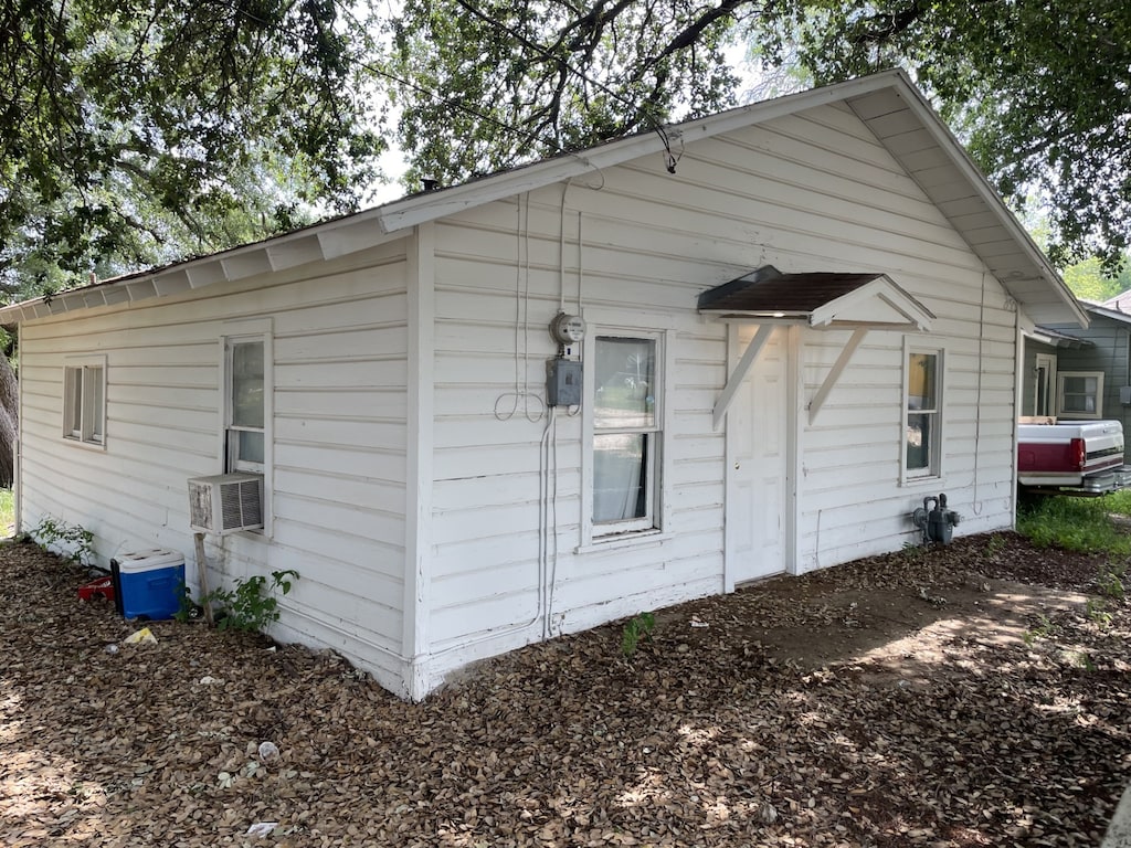 view of side of property with central AC