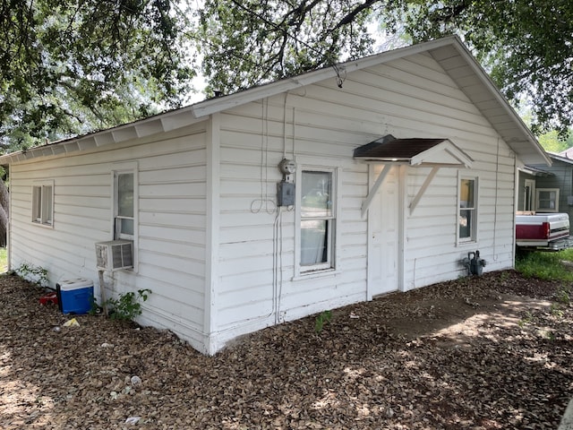 view of side of property with central AC