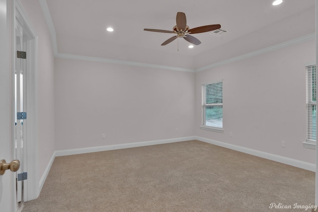 carpeted spare room featuring ornamental molding and ceiling fan