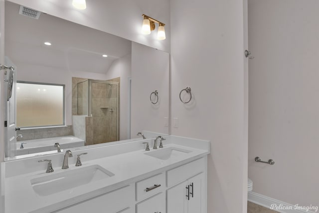 full bathroom featuring dual bowl vanity, toilet, and shower with separate bathtub