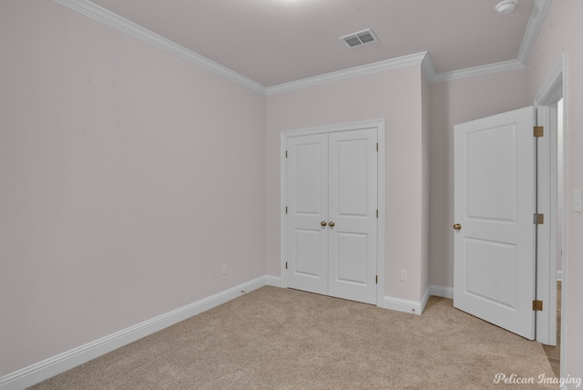 unfurnished bedroom with light carpet, a closet, and ornamental molding