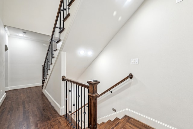 stairway with hardwood / wood-style flooring