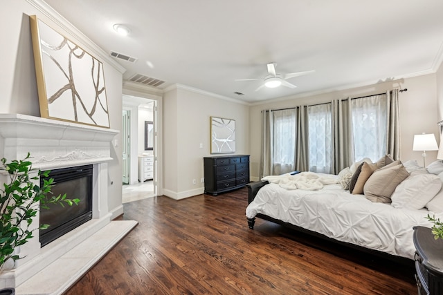 bedroom with dark hardwood / wood-style flooring, ceiling fan, and ornamental molding