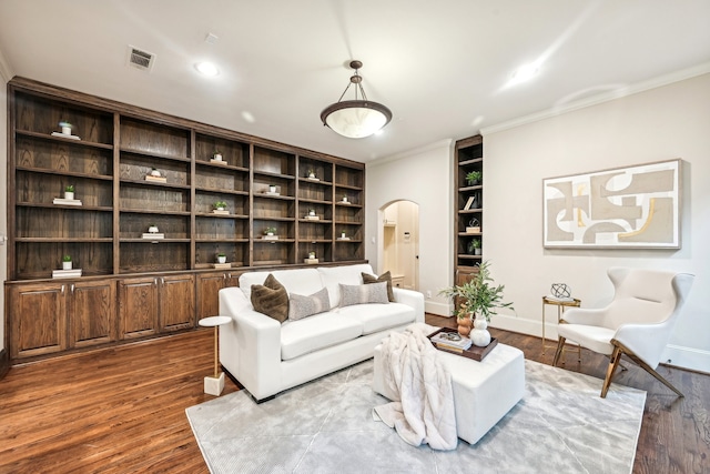 living room with ornamental molding and dark hardwood / wood-style floors