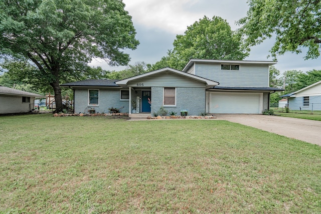 view of front facade with a garage and a front yard