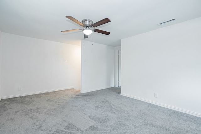 empty room featuring ceiling fan and carpet floors