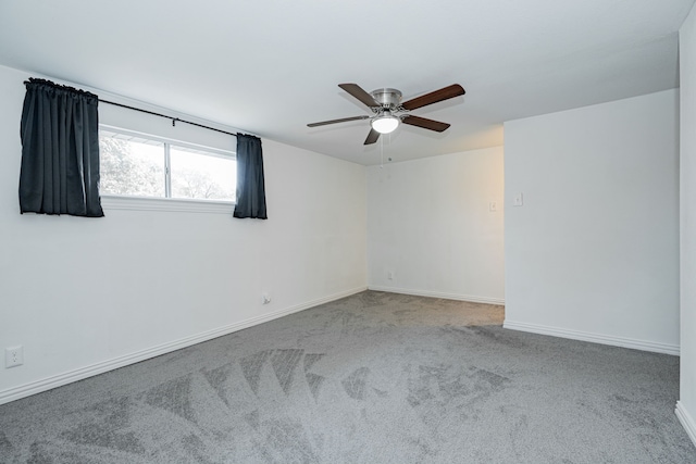 spare room with ceiling fan and carpet floors