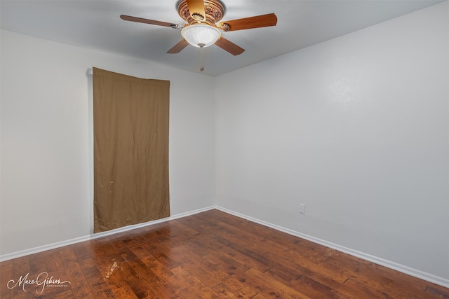 empty room with ceiling fan and hardwood / wood-style floors