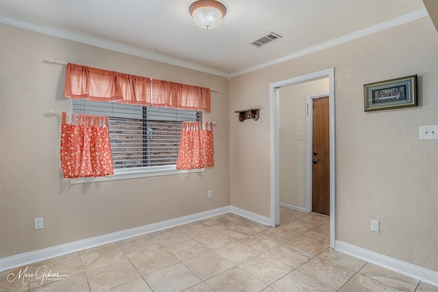 tiled empty room featuring ornamental molding