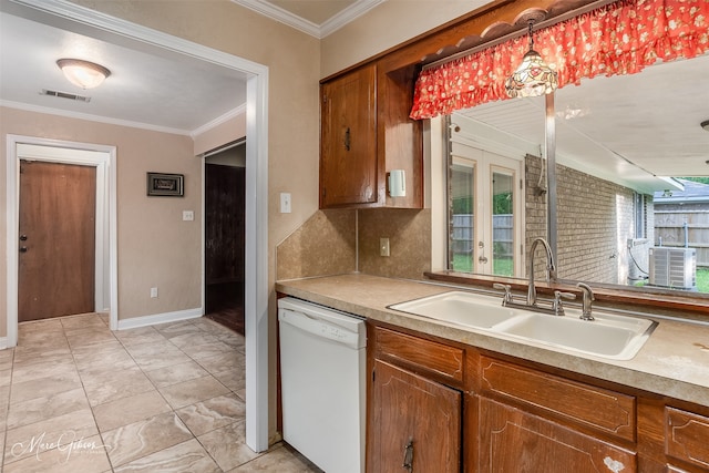 kitchen featuring ornamental molding, plenty of natural light, pendant lighting, and white dishwasher