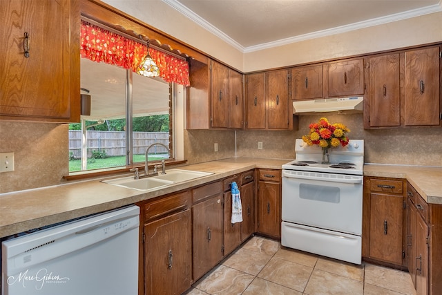 kitchen with backsplash, white appliances, sink, and ornamental molding