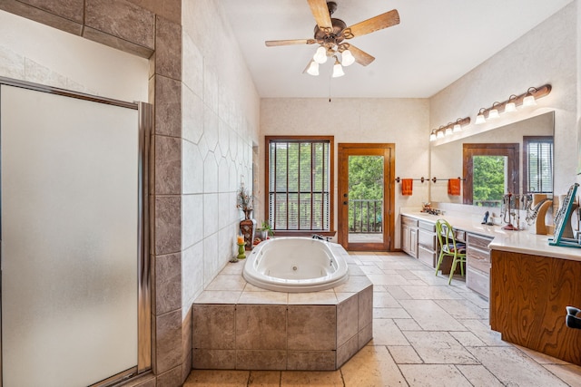 bathroom featuring tile flooring, ceiling fan, a healthy amount of sunlight, and large vanity