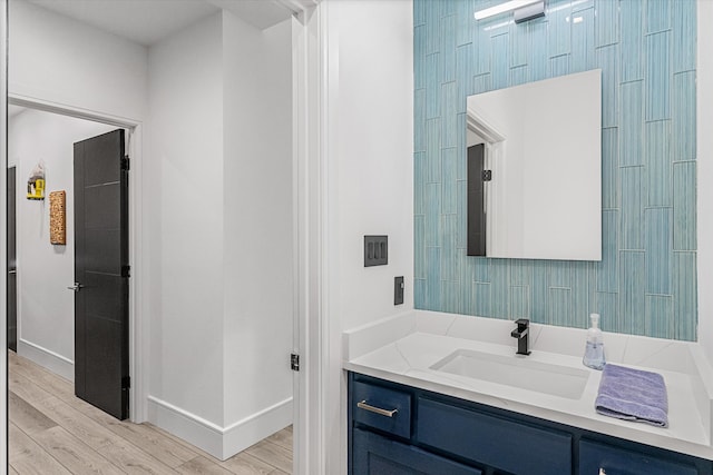 bathroom with hardwood / wood-style flooring and vanity