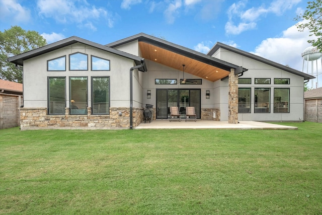 back of house with a patio area, ceiling fan, and a lawn