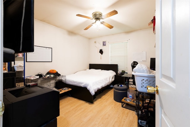 bedroom with ceiling fan and light wood-type flooring