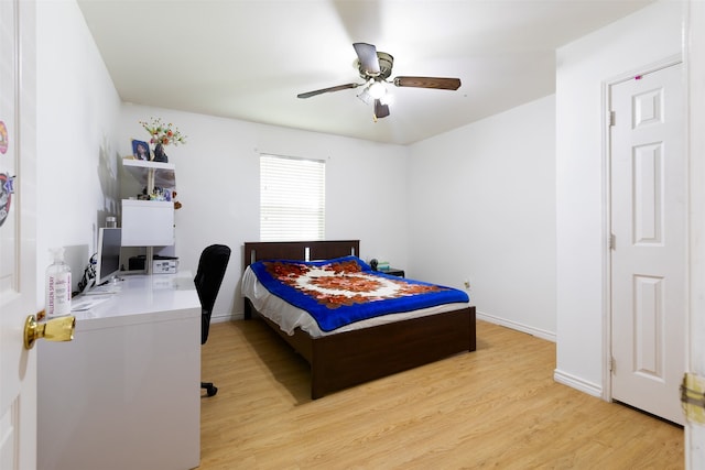 bedroom with ceiling fan and light hardwood / wood-style floors