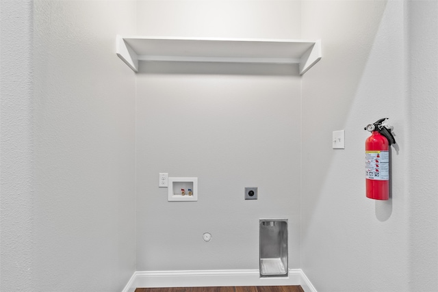 washroom with hookup for an electric dryer, gas dryer hookup, washer hookup, and hardwood / wood-style flooring