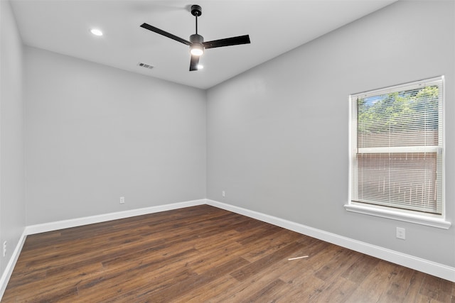 empty room featuring dark hardwood / wood-style floors and ceiling fan