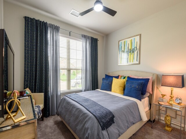 carpeted bedroom with ceiling fan