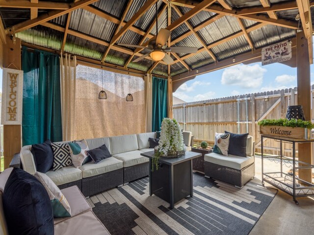 view of terrace featuring a gazebo, ceiling fan, and an outdoor hangout area