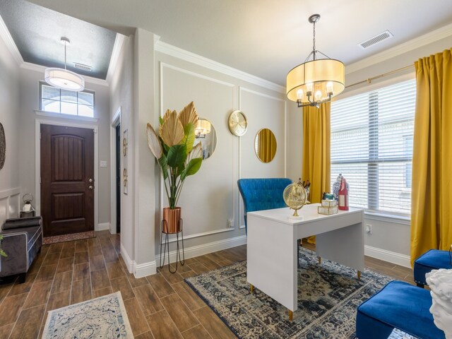 office with a notable chandelier, crown molding, and dark wood-type flooring