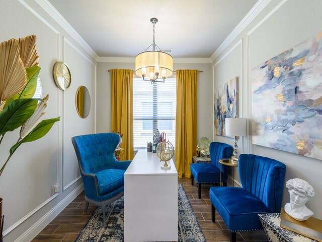 sitting room featuring crown molding, a chandelier, and dark hardwood / wood-style floors