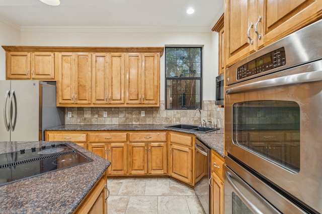 kitchen with stainless steel appliances, sink, tasteful backsplash, and light tile floors