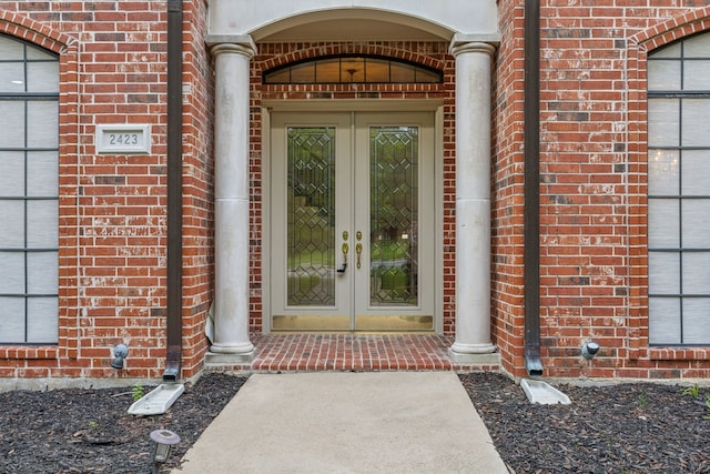 property entrance featuring french doors