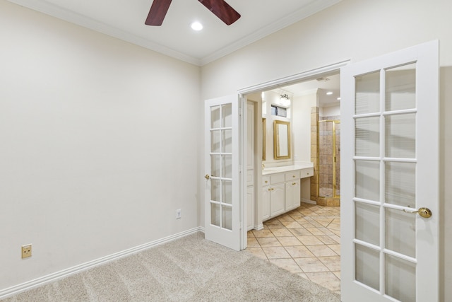 unfurnished room with crown molding, french doors, ceiling fan, and light tile floors