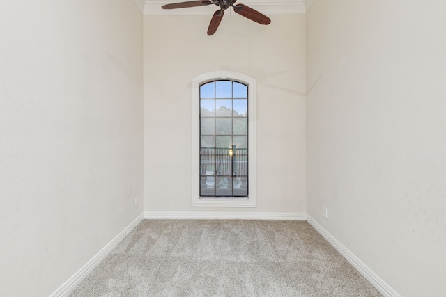 spare room featuring carpet floors and ceiling fan