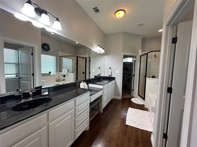 bathroom featuring shower with separate bathtub, vanity, and hardwood / wood-style flooring