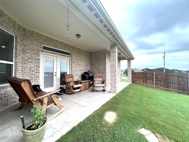 view of patio featuring a grill and french doors