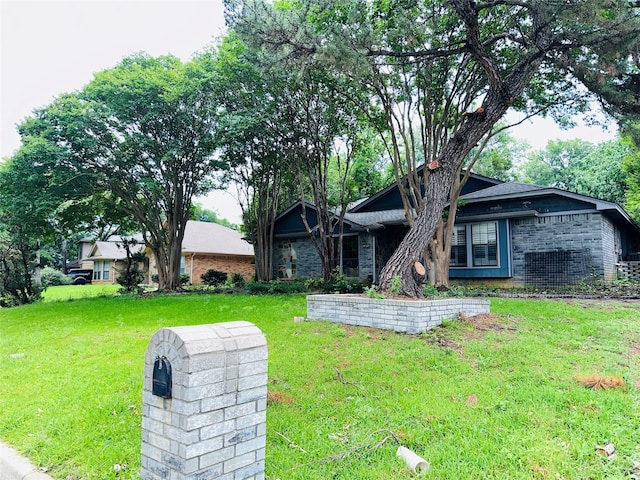 ranch-style house with a front lawn