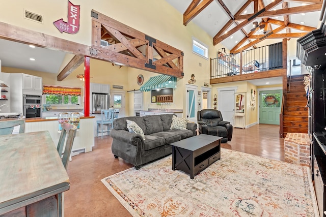 living room featuring high vaulted ceiling and beam ceiling