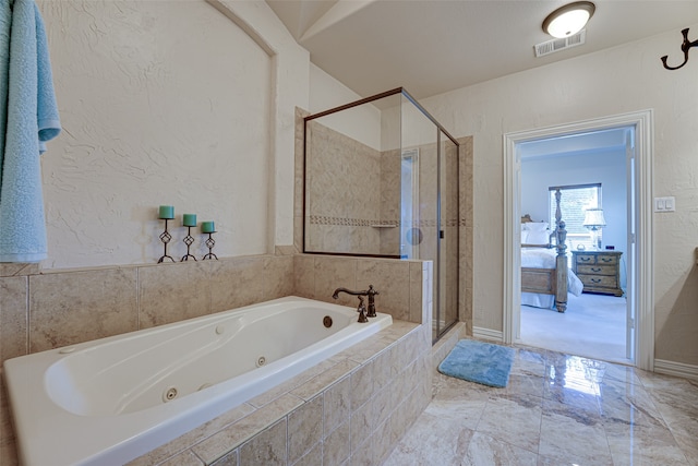 bathroom featuring tile flooring and separate shower and tub