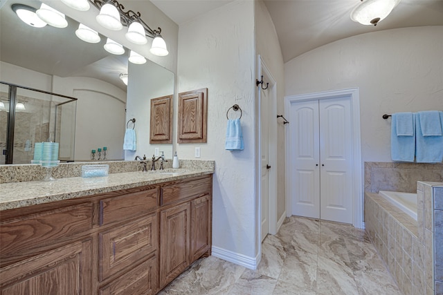 bathroom featuring vaulted ceiling, vanity, separate shower and tub, and tile flooring