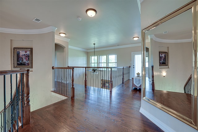 hallway with crown molding and dark wood-type flooring