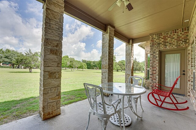 view of terrace featuring ceiling fan