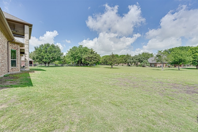 view of yard featuring ceiling fan