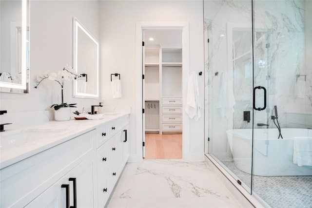 bathroom featuring tile floors, dual bowl vanity, and shower with separate bathtub