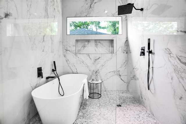 bathroom featuring separate shower and tub and tile walls