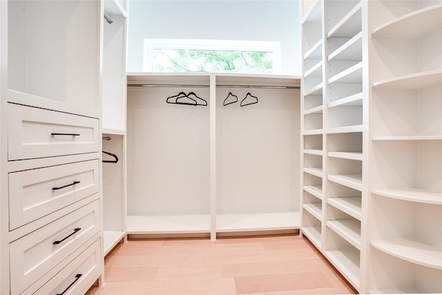 walk in closet featuring light hardwood / wood-style floors